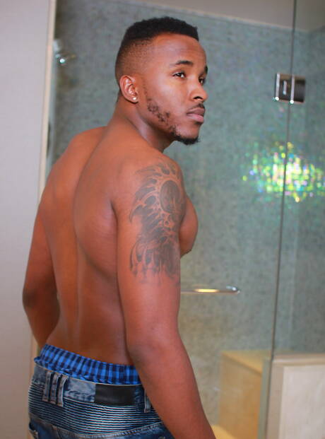 Man Royale: American beefy Brendan Phillips and superstud  phoenix Fellington in interracial cock sucking scene in hot shower