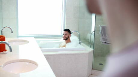 Well-built Blake Carson and husky guy Hugo Diaz in hot homosexual action in bathroom