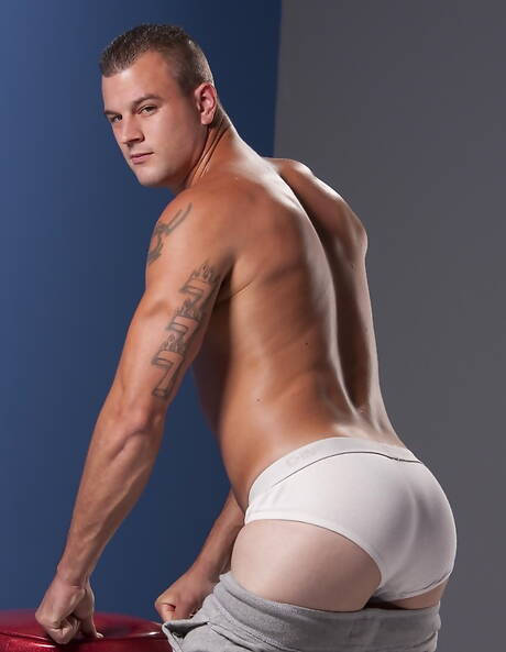 American beefcake Brandon Lewis posing nude and showing tight butt