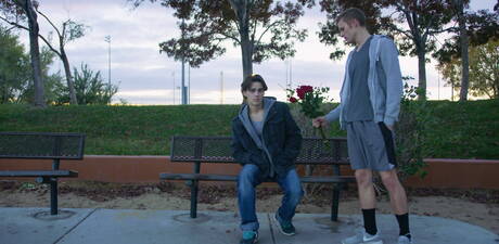 Two american boys beefy Justin Owen and young boy Ty Thomas love each other outdoor