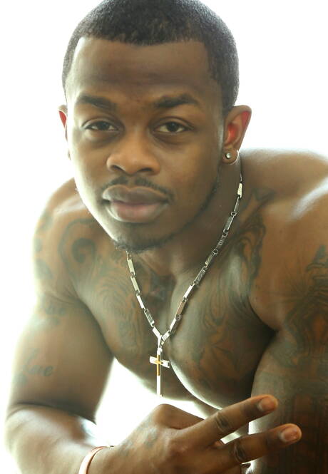 Ebony bodybuilder Mustang undressing and showing hot butt