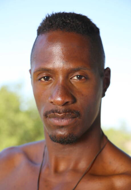 Ebony beefy Derek Maxum undressing and showing hot butt outside