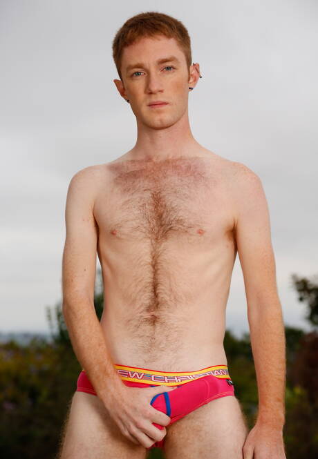 Hot twink Seamus Orilley undressing and showing tight ass outside