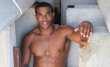 Ebony strong bull Tyrell posing naked and showing nice ass in the pool