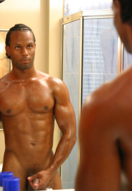 Black bodybuilder Tone playing with dick in bathroom