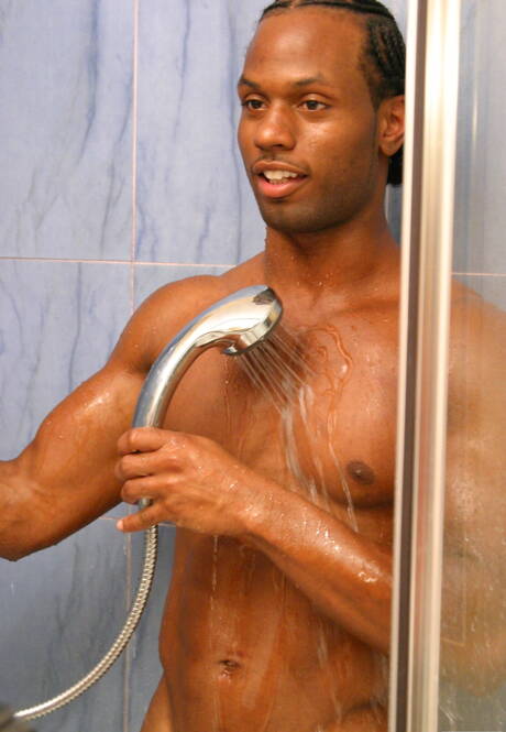Black bodybuilder Tone playing with dick in bathroom