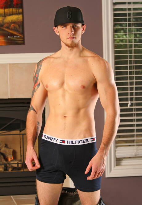 Hunky guy Flexx Boola teasing his cock