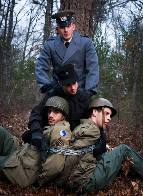 Military gays Ty,Sam, Trent and Alexander Gustavo posing and kissing outdoors
