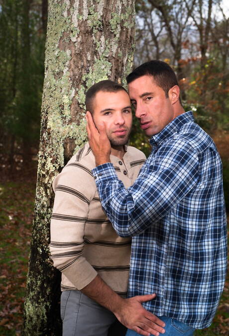 Mature Nick Capra posing with hot young gays outdoors