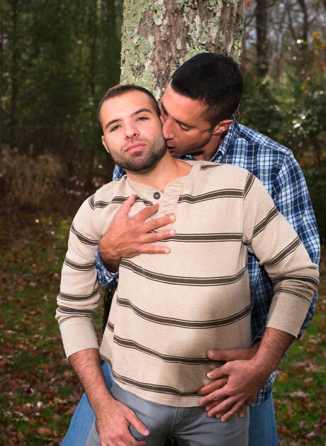 Mature Nick Capra posing with hot young gays outdoors