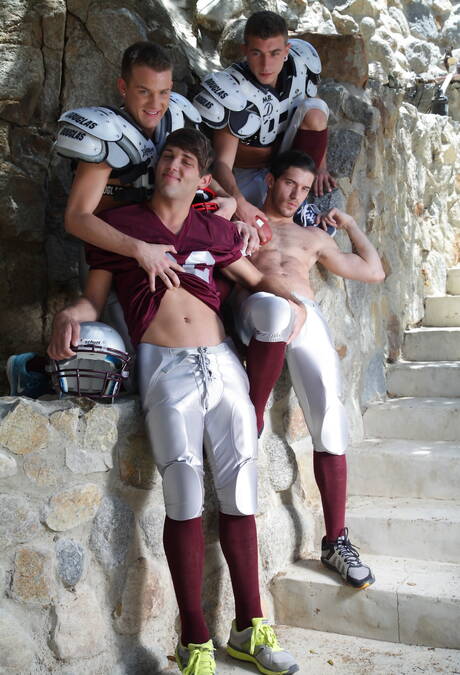 Sporty gays Aiden, Alexander and Brandon posing in football uniform