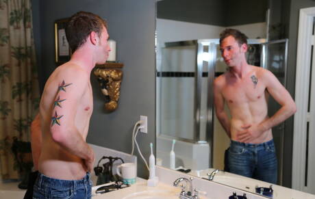 American young dude Tripp Townsend playing with cock in bathroom