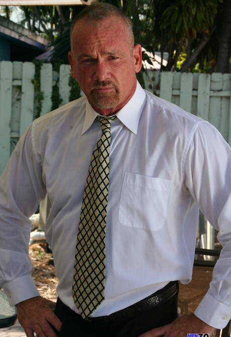 Hairy bear Mickey Collins stripping off outdoor