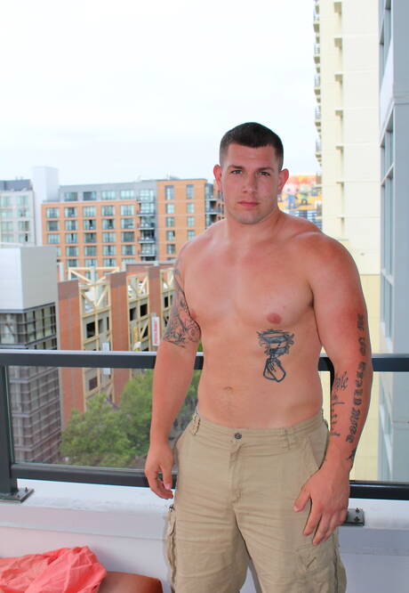 Muscular Jeremy Diesel teasing his cock outside