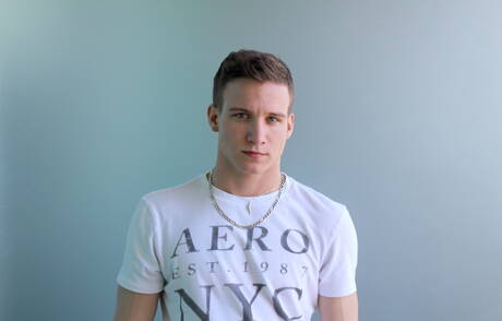 Active Duty: Stud Mike Hollister shows a muscle body outdoor