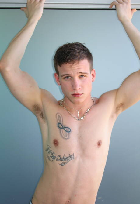 Stud Mike Hollister shows a muscle body outdoor