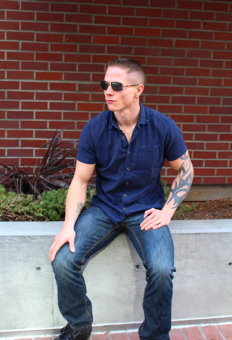 Muscular Guy Houston shows a muscle body outdoor