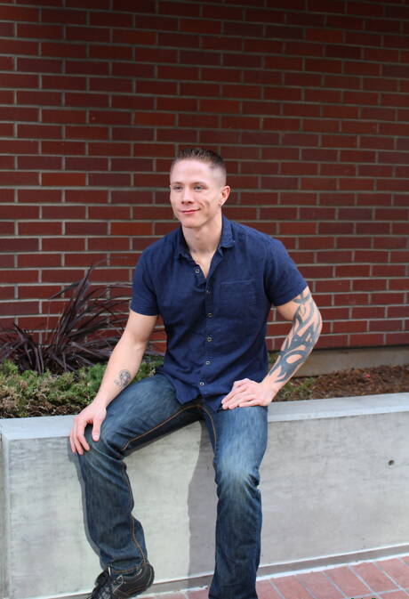 Muscular Guy Houston shows a muscle body outdoor