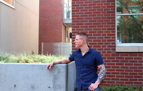 Muscular Guy Houston shows a muscle body outdoor