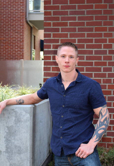 Muscular Guy Houston shows a muscle body outdoor