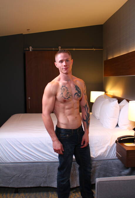 Muscular Guy Houston shows a muscle body outdoor