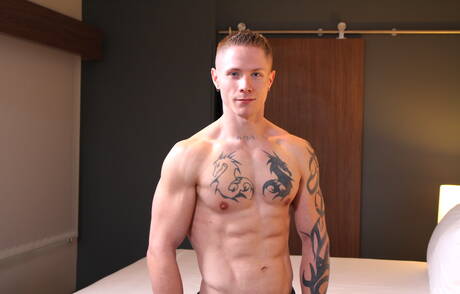 Muscular Guy Houston shows a muscle body outdoor