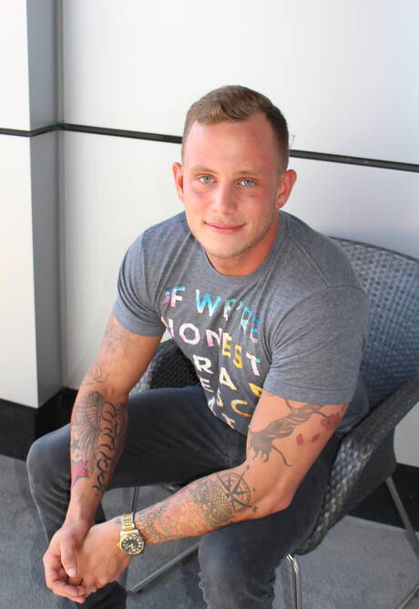 Active Duty: American hunk Zack Matthews shows a well-build body outside