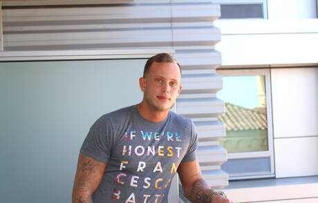 American hunk Zack Matthews shows a well-build body outside