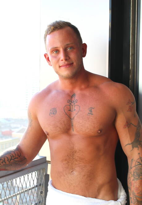 American hunk Zack Matthews shows a well-build body outside