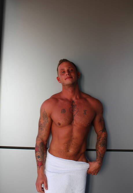 American hunk Zack Matthews shows a well-build body outside