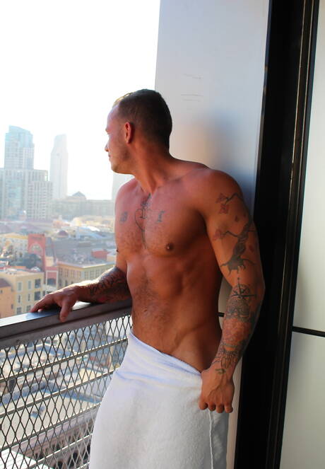 American hunk Zack Matthews shows a well-build body outside