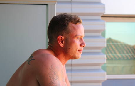 American hunk Zack Matthews shows a well-build body outside