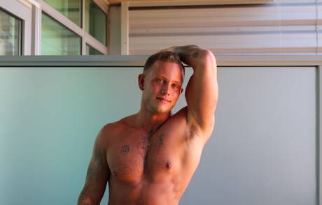 American hunk Zack Matthews shows a well-build body outside