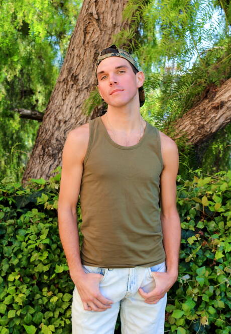 Well-built Joshua Kelly masturbating outdoor