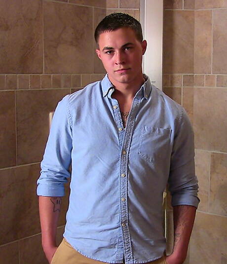 Muscular Grant shows a well-build body in bathroom