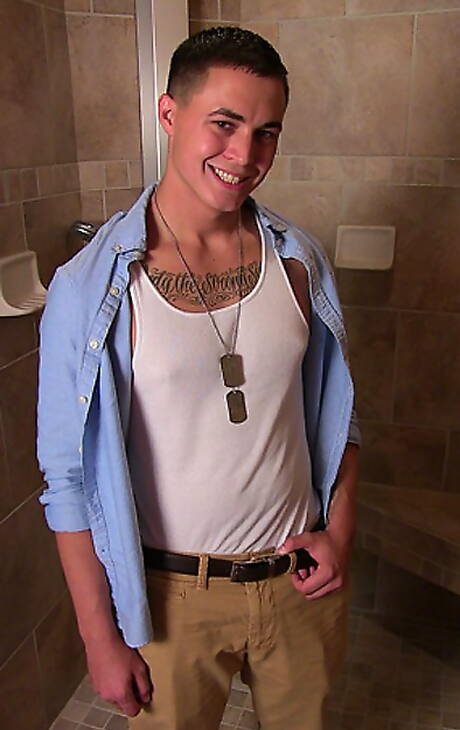 Muscular Grant shows a well-build body in bathroom