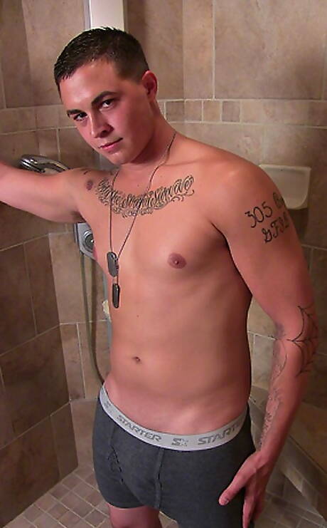 Muscular Grant shows a well-build body in bathroom