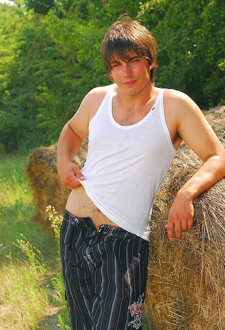 Hunk Rick Boy posing nude and showing tight butt outside