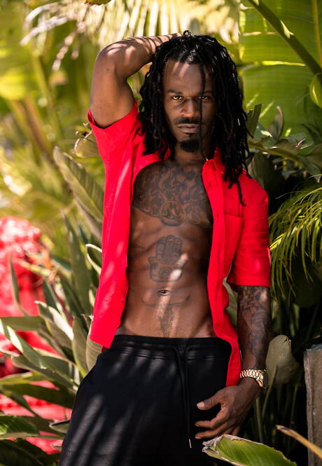 Noir Male: Ebony superstud Fame shows a well-build body at the pool