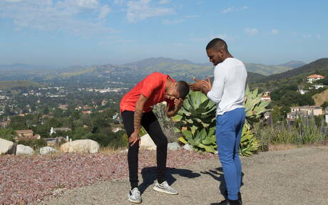 Black beefy Aaron Reese and muscular Leon Reddz in hard anal sex outdoor