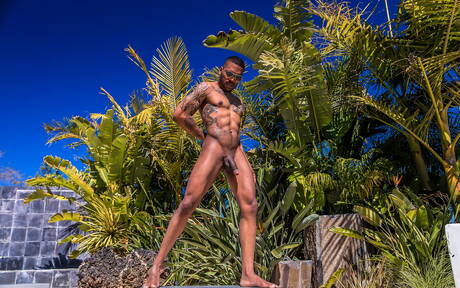 Black muscular Aaron Reese shows a husky body outdoor