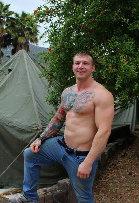 Active Duty: Bodybuilder Mike Johnson shows a sturdy body outdoor