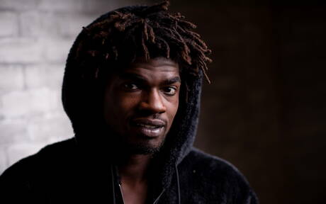 Ebony beefy Devin Trez shows a muscle body