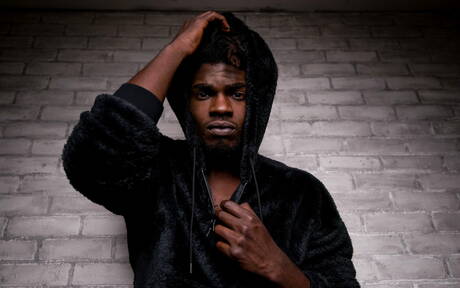 Ebony beefy Devin Trez shows a muscle body