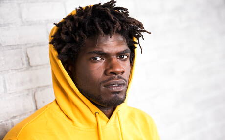 Ebony beefy Devin Trez shows a muscle body