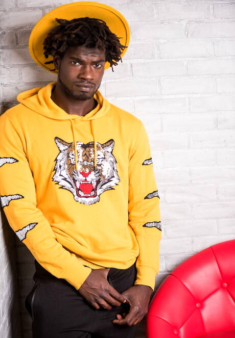 Ebony beefy Devin Trez shows a muscle body