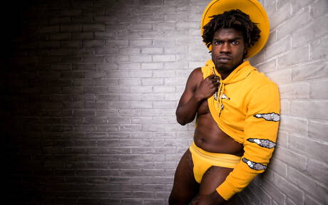 Ebony beefy Devin Trez shows a muscle body