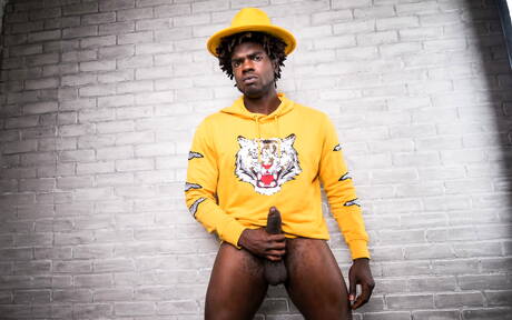 Ebony beefy Devin Trez shows a muscle body