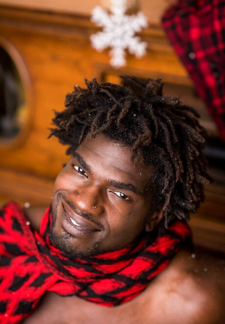 Ebony beefy Devin Trez shows a muscle body