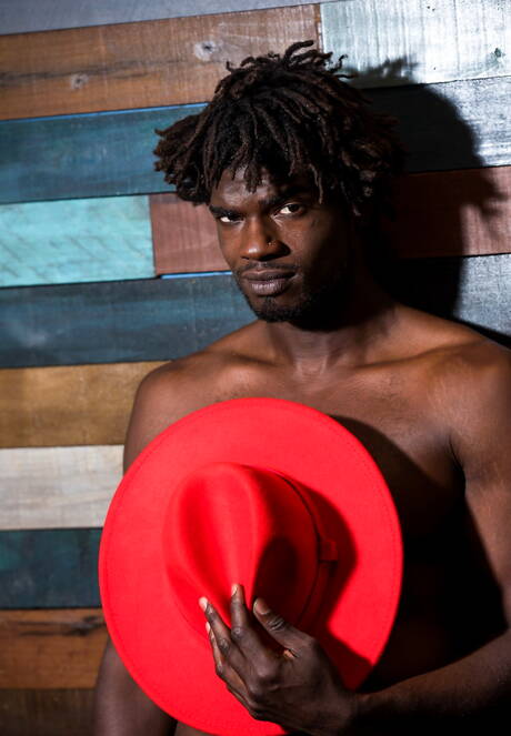 Ebony beefy Devin Trez shows a muscle body